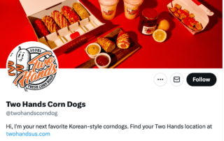 two hands corn dogs